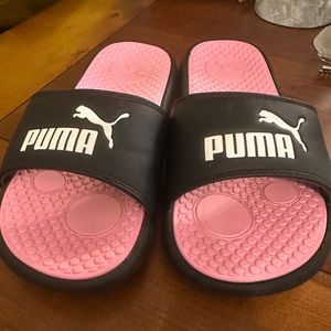Puma Slides/sandals. Pink sole , white lettering rest is black